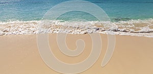 Waves on sandy Caribbean beach