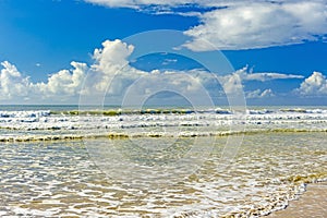 Waves and sea foam in the vividly colored sea