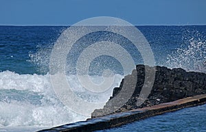 WAVES AND SEA SPRAY OUTSIDE TIDAL POOL