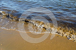 Waves at the seashore at sunset.