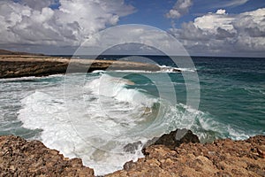 Waves shattering onto rocky Caribbean coast