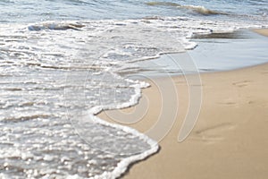 Waves on Shore of White Sand Beach