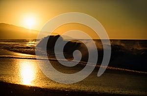 Waves splashes. Sea waves background. Sunset over sea with golden dramatic sky panorama. Calm sea with sunset sky. Ocean