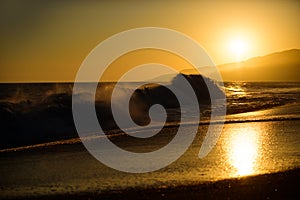 Waves splashes. Sea waves background. Sunset over sea with golden dramatic sky panorama. Calm sea with sunset sky. Ocean