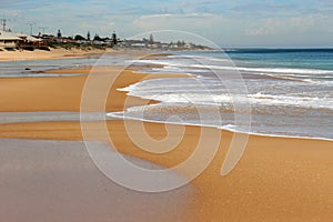 Waves splashing on basalt rocks at Ocean beach Bunbury Western Australia