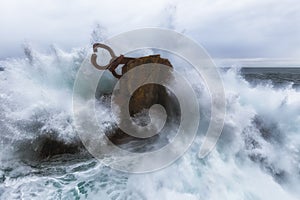 Waves splashing in El peine de los vientos, Chillida`s sculpture photo
