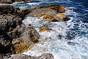 Waves splashing into rocks