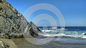 Waves splashing on rocks landscape