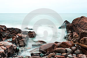 Waves, stones and rocky shoreline on Black Brook Beach, Canada