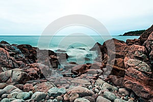 Waves, stones and rocky shoreline on Black Brook Beach, Canada