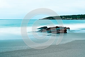 Waves, stones and rocky shoreline on Black Brook Beach, Canada