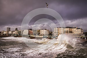 Waves and a storm blowing into Brighton