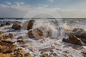 Waves stumble across rocks on the coast