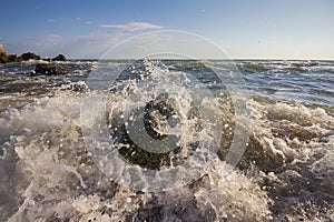 Waves stumble across rocks on the coast