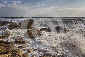 Waves stumble across rocks on the coast