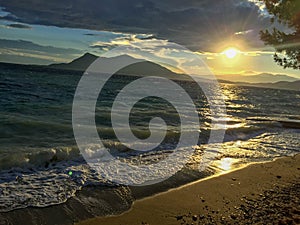 Waves and sunset in Aidipsos, Evia, Grece.