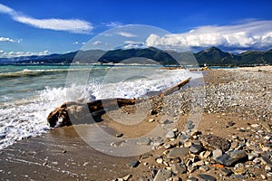 Waves and surf on the beach.  Pebble beach in the resort of Kabardinka, Krasnodar region, Black sea.