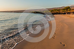 Waves Washing Ashore on The Golden Sands Of Mau\'umae Beach