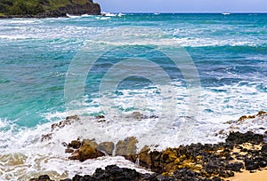 Waves Washing Over an Exposed Lava Reef at Kahili Beach