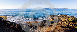 Waves Washing Over Lava on Little Beach With Kaho\'olawe Island and Molokini on The Horizon