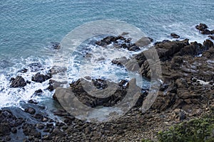 Waves Washing Over Rocks at Beach, Sunrise