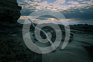 Waves Washing Over Rocks at Beach, Sunrise