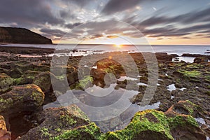 Waves Washing Over Rocks at Beach, Sunrise