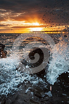 Waves Washing Over Rocks at Sunrise