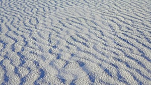 Waves on the white sand of gypsum in the White Sands National Monument in New Mexico, USA