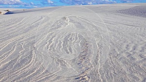 Waves on the white sand of gypsum in the White Sands National Monument in New Mexico, USA