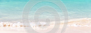 Waves on white sand and turquoise water, panoramic background