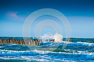 Waves and wooden pier