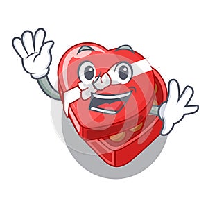 Waving choclate heart box in shape mascot