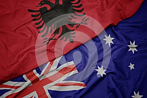 waving colorful flag of australia and national flag of albania