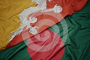 waving colorful flag of bangladesh and national flag of bhutan