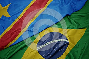 waving colorful flag of brazil and national flag of democratic republic of the congo photo