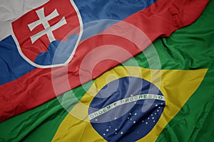 Waving colorful flag of brazil and national flag of slovakia