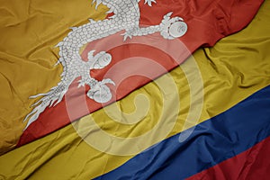 waving colorful flag of colombia and national flag of bhutan