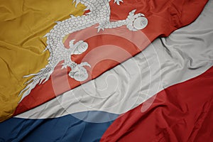 waving colorful flag of czech republic and national flag of bhutan