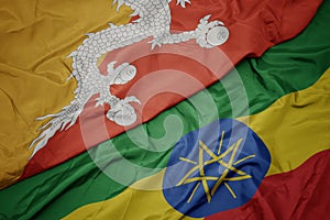 Waving colorful flag of ethiopia and national flag of bhutan