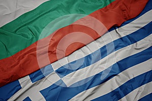 waving colorful flag of greece and national flag of bulgaria