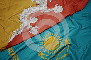 waving colorful flag of kazakhstan and national flag of bhutan