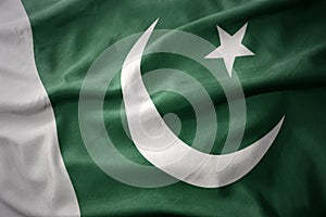 Waving colorful flag of pakistan. photo
