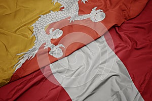 waving colorful flag of peru and national flag of bhutan