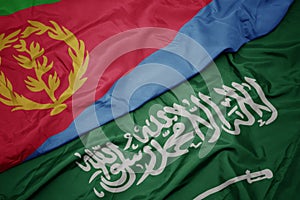 waving colorful flag of saudi arabia and national flag of eritrea