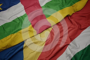 waving colorful flag of seychelles and national flag of central african republic