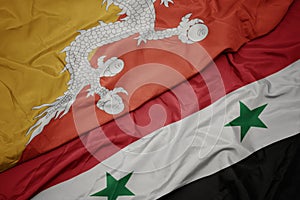 waving colorful flag of syria and national flag of bhutan