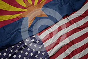 waving colorful flag of united states of america and flag of arizona state