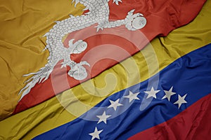 waving colorful flag of venezuela and national flag of bhutan