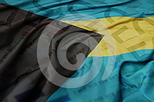 waving colorful national flag of bahamas on a euro money banknotes background. finance concept